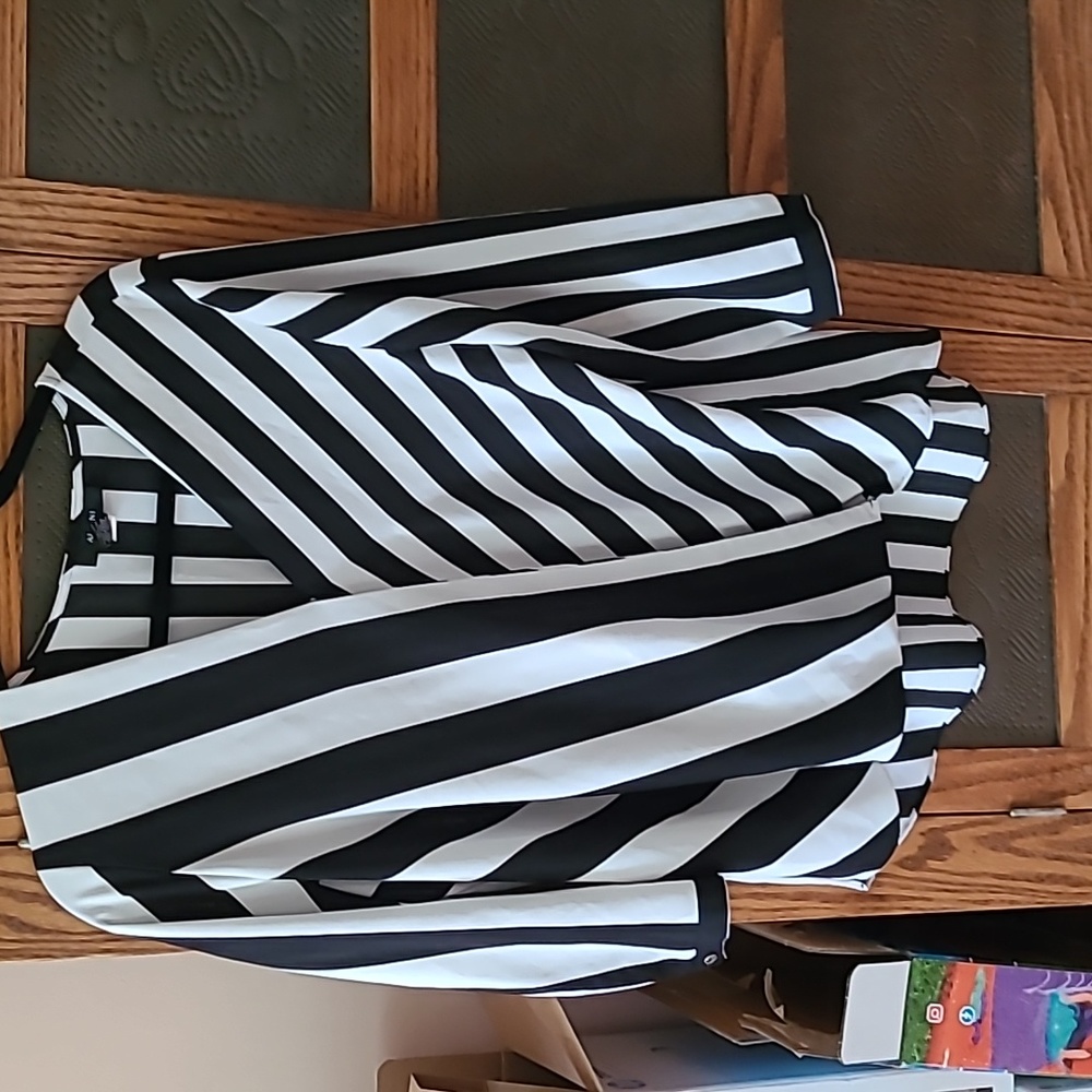 Alfani wrap around top. 100& polyester..striped bodice closes with snap in front